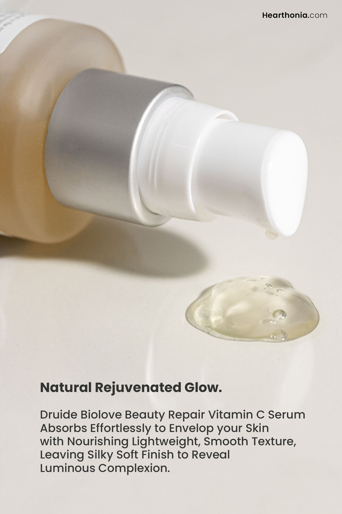 Druide Biolove Organic Vitamin C Serum glass bottle with dispensed light beige/pink serum sample squeezed out.
