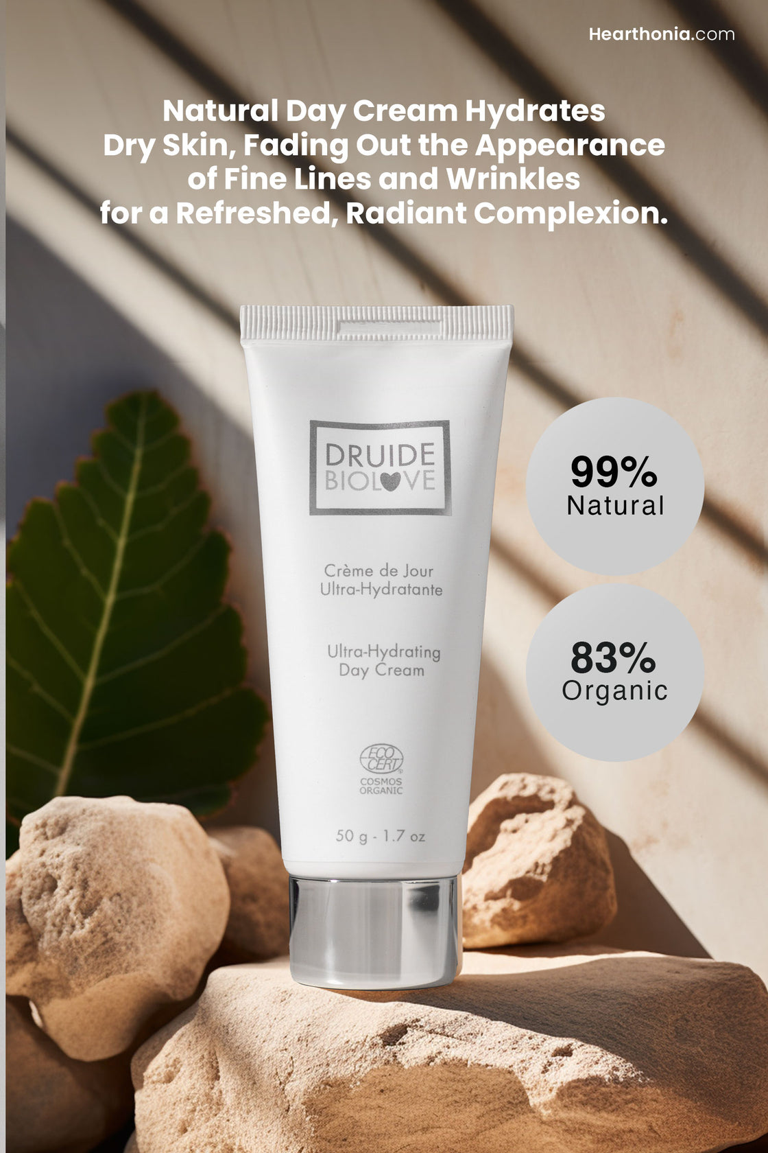 Druide Biolove Organic Ultra-Hydrating Day Cream white tube propped on rocks and large plant in background with text "99% natural and 83% organic" and "natural day cream hydrates dry skin, fading out appearance of fine lines and wrinkles for a refreshed radiant complexion".