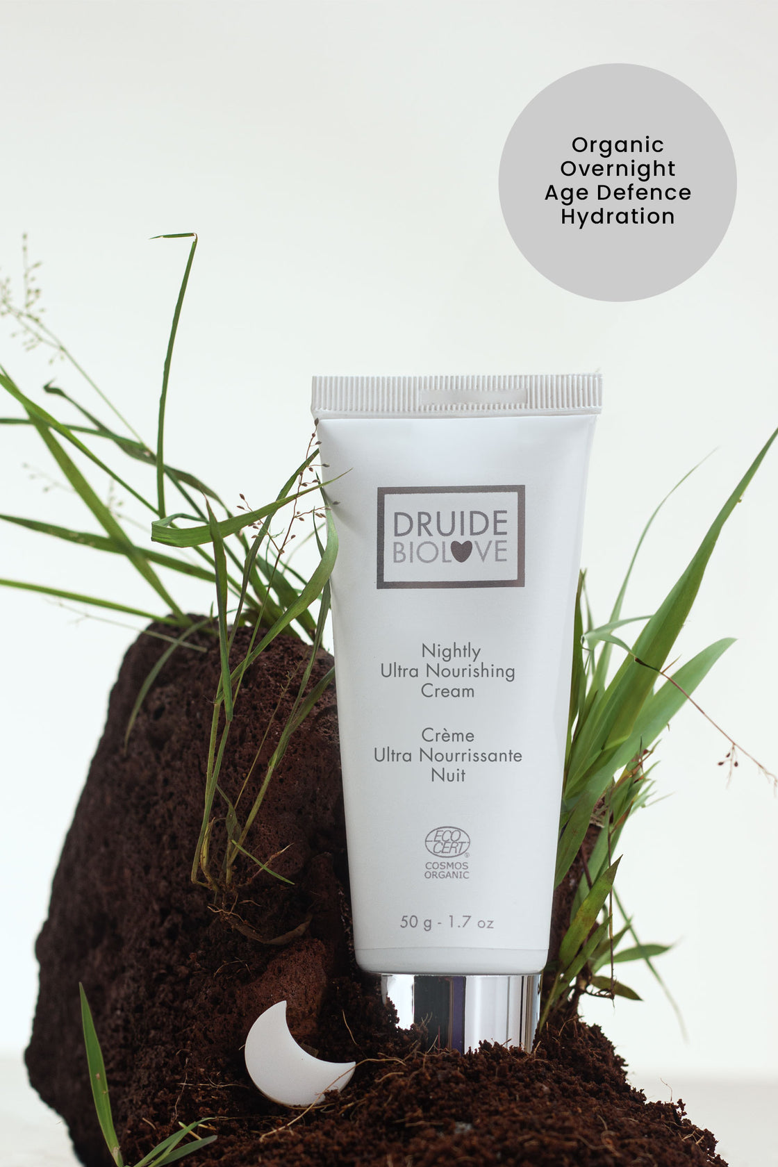 Druide Biolove Organic Nightly Ultra Nourishing Cream tube shown on natural soil and grass with text "organic overnight age defence hydration".