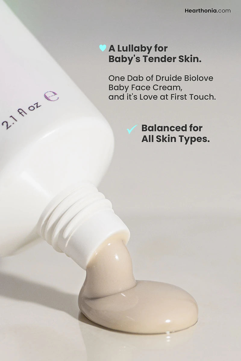 Druide Biolove Organic Baby Face Cream, a luxurious, rich off-white cream dispensed from a tube, offering gentle care for baby's delicate skin. © 2024 HQBASICS Ltd, United Kingdom (trading as Hearthonia). All rights reserved.