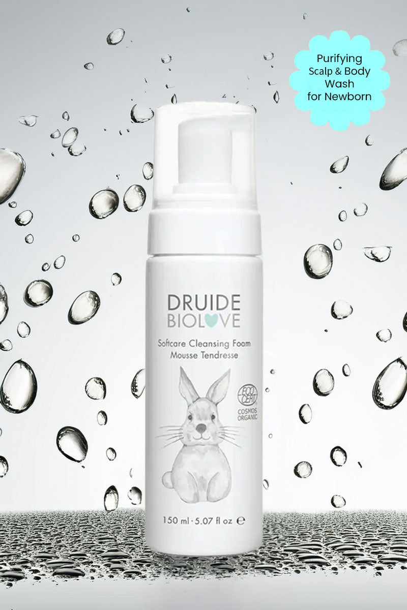 Druide Biolove Organic Baby Wash Cleansing Mousse dispenser against background if water beads with text "purifying scalp and body wash for newborn".