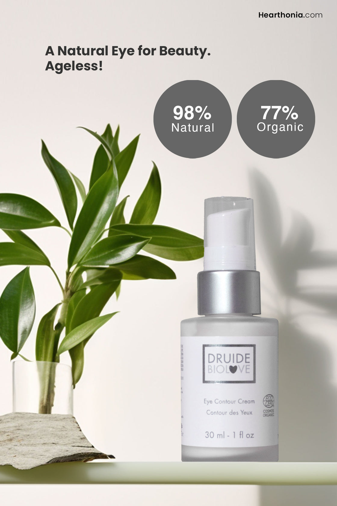 Druide Biolove Organic Eye Contour Cream placed on a shelf amidst green plants and text reading "98% natural and 77% organic, and the statement a natural eye beauty, Ageless."