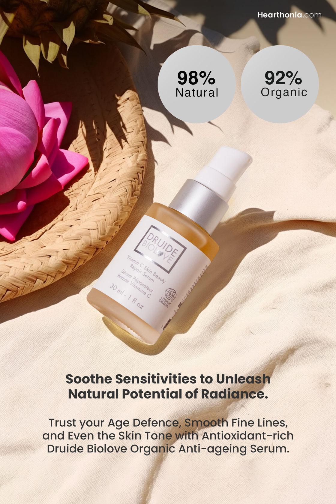 Druide Biolove Organic Vitamin C serum  laid on a beige cloth next to wicker basket holing a bloomed lotus flower, with text stating "98% natural and 92% organic, It soothes sensitivities to unleash the natural potential of radiance".