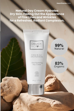Druide Biolove Organic Ultra-Hydrating Day Cream white tube propped on rocks and large plant in background with text 