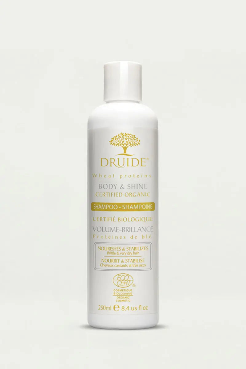 Druide Body & Shine Shampoo for Dry & brittle hair flip top dispenser against clear background.
