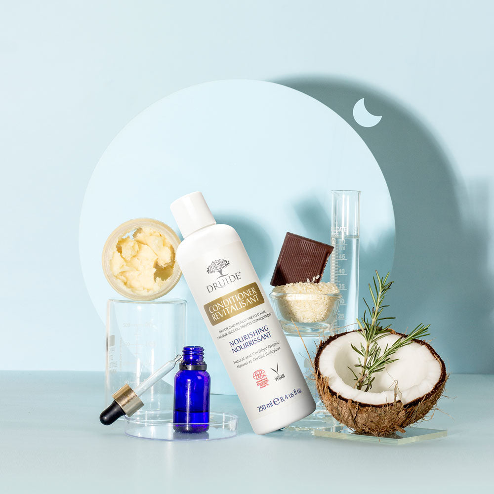 Druide Natural Hair Conditioner shown with organic ingredients such as  coconut, shea butter, cacao, rosemary.