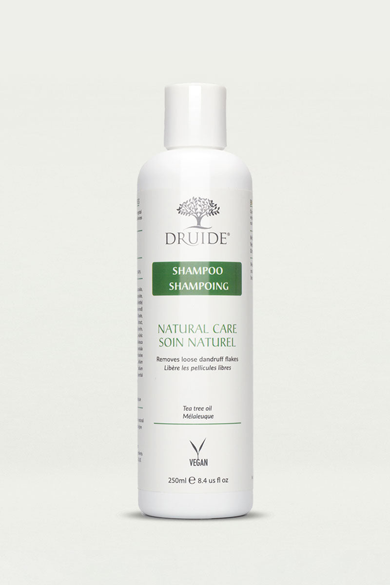 Druide Tea Tree Oil Shampoo for Dandruff 250 ml flip top white dispenser shown against a clear background.