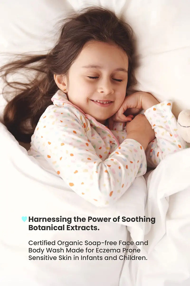 young girl pretending to sleep and smile at the same time, text reading "harnessing the power of soothing botanical extracts, certified organic soap-free face and body wash made for eczema prone sensitive skin in infants and children".