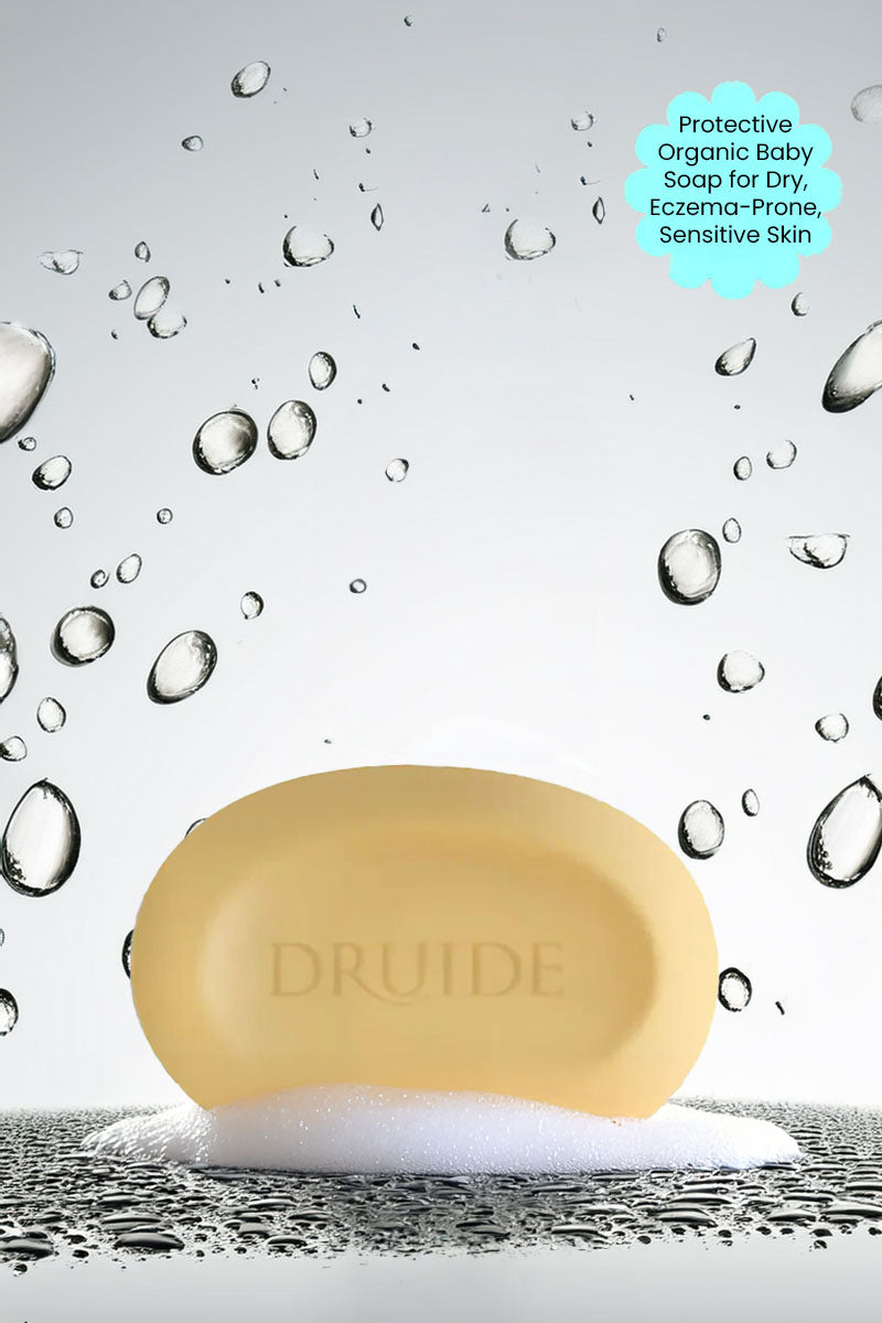 Druide Biolove Protective Soap Bar against background if water beads with text "protective organic baby soap for dry eczema prone sensitive skin".