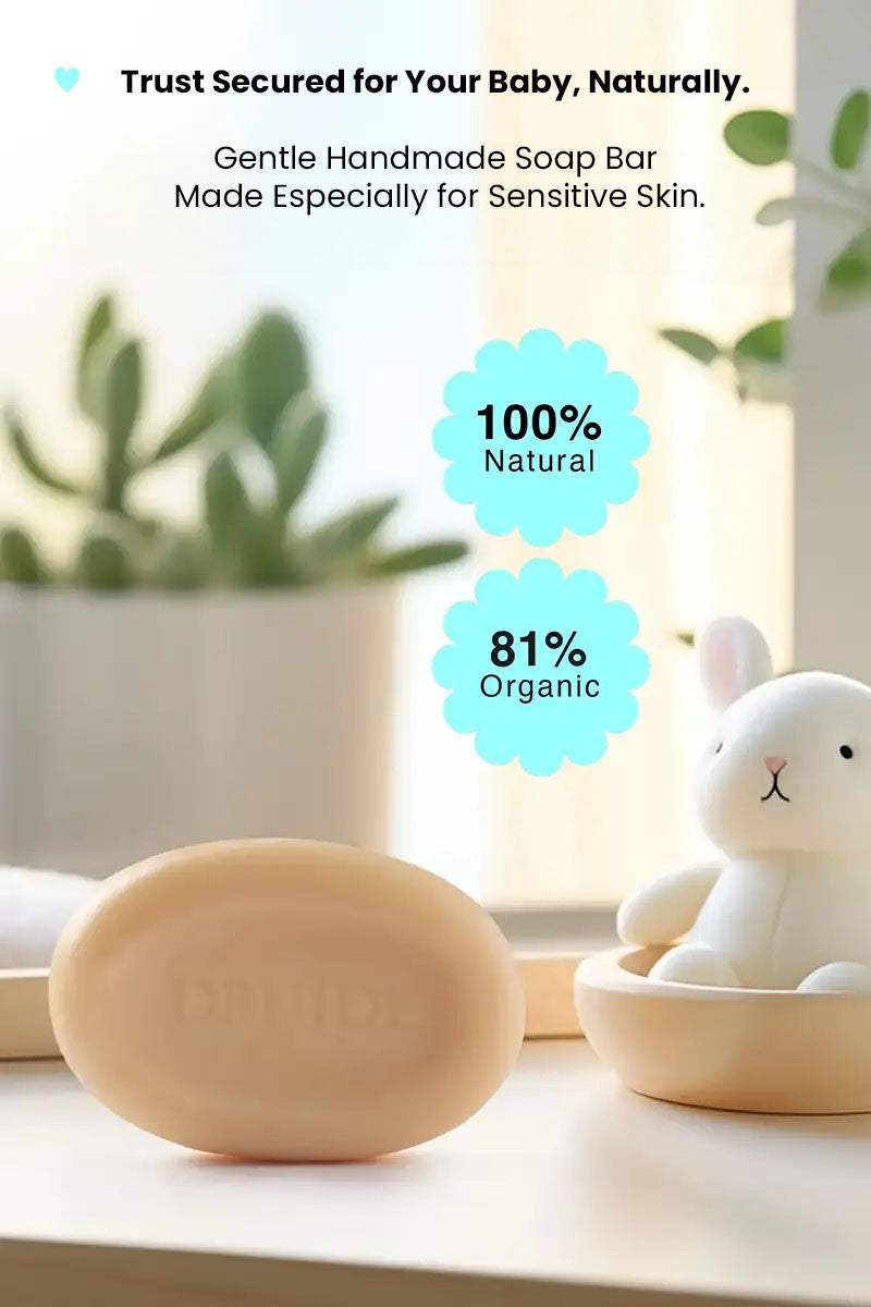 Druide Biolove Protective Soap Bar on a bathroom shelf with green plants and a teddy bear toy in background and text reading "100% natural, 81% organic, trust secured for your baby, naturally".