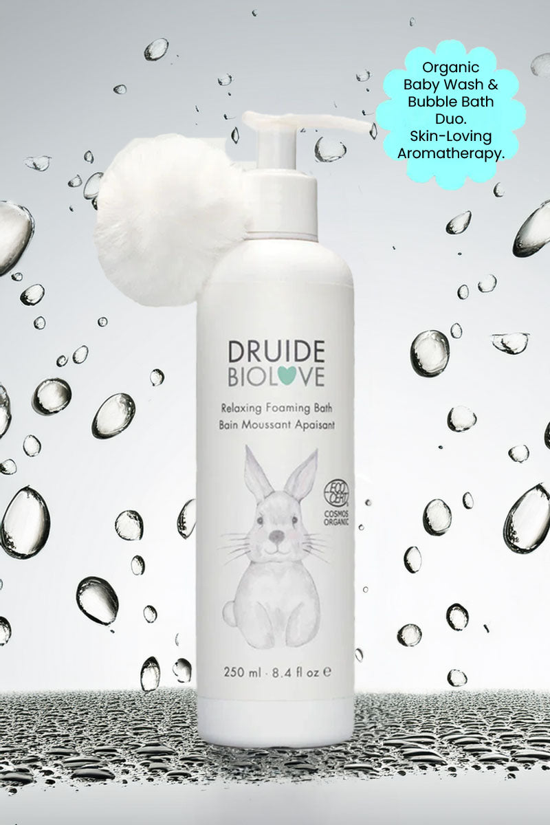 Druide Biolove Relaxing Foaming Baby Bubble Bath against background if water beads with text "organic baby wash and bubble bath duo skin loving aromatherapy".