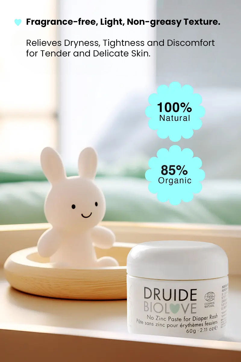 Druide Biolove organic baby balm tub on table with a teddy bear in background and text reading "100% natural 85% organic, fragrance free, light, non greasy texture, relieves dryness, tightness and discomfort for tender and delicate skin".