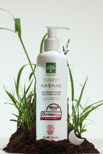 Druide Pur and Pure Organic Face and  Body Lotion dispenser against background of fresh soil and green grass.