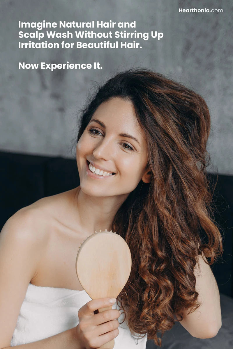 happy woman combing her healthy hair with text reading "imagine natural hair and scalp wash without stirring up irritation for beautiful hair".