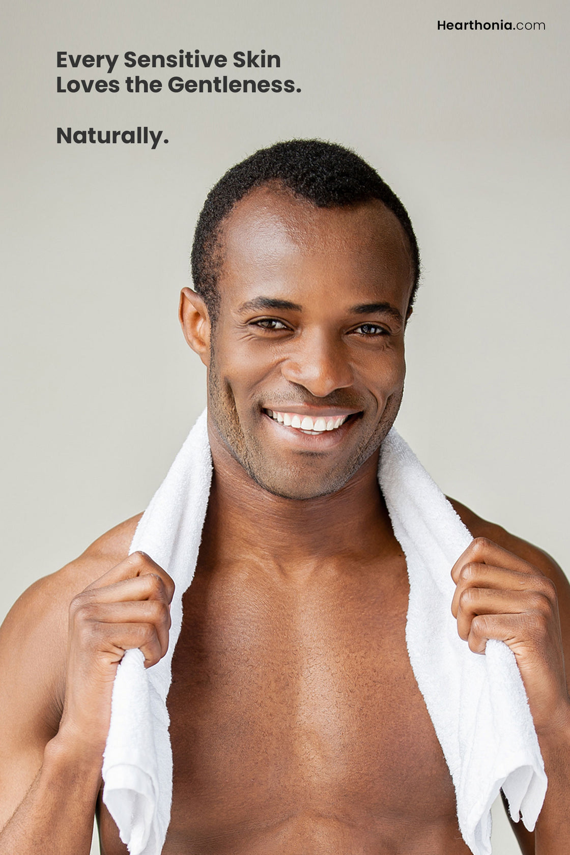 A smiling man with a towel hanging around neck with text reading "every sensitive skin loves the gentleness".