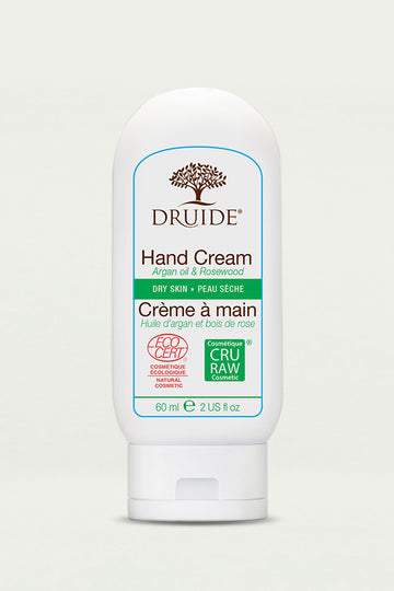 Druide organic Hand Cream for Dry Skin compact 60 ml, 2 US fl. oz. dispenser with Ecocert certified cosmos organic icon shown against a clear background.