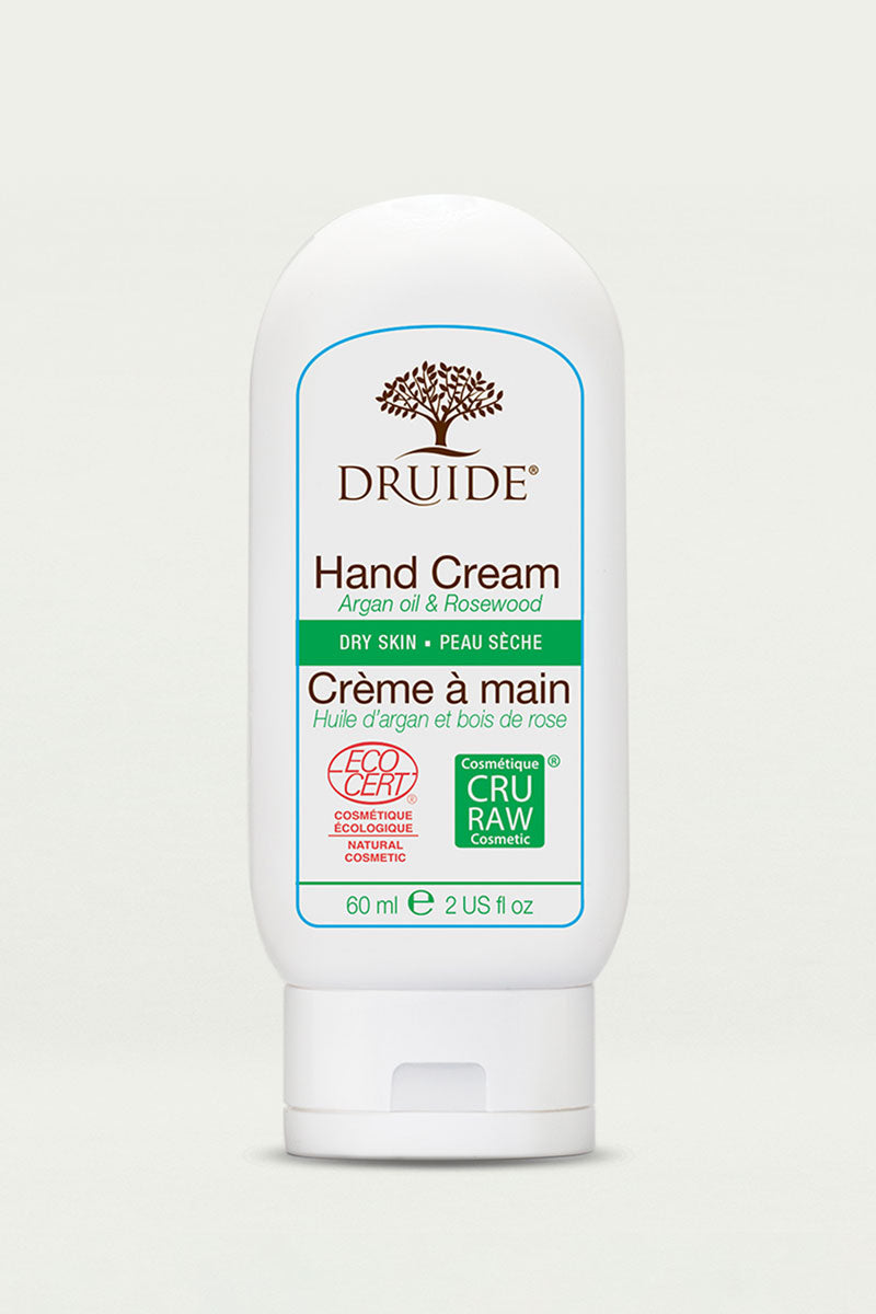 Druide organic Hand Cream for Dry Skin compact 60 ml, 2 US fl. oz. dispenser with Ecocert certified cosmos organic icon shown against a clear background.