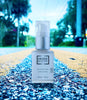 Druide Biolove eye contour cream bottle on UK country highway with blurred outdoor background